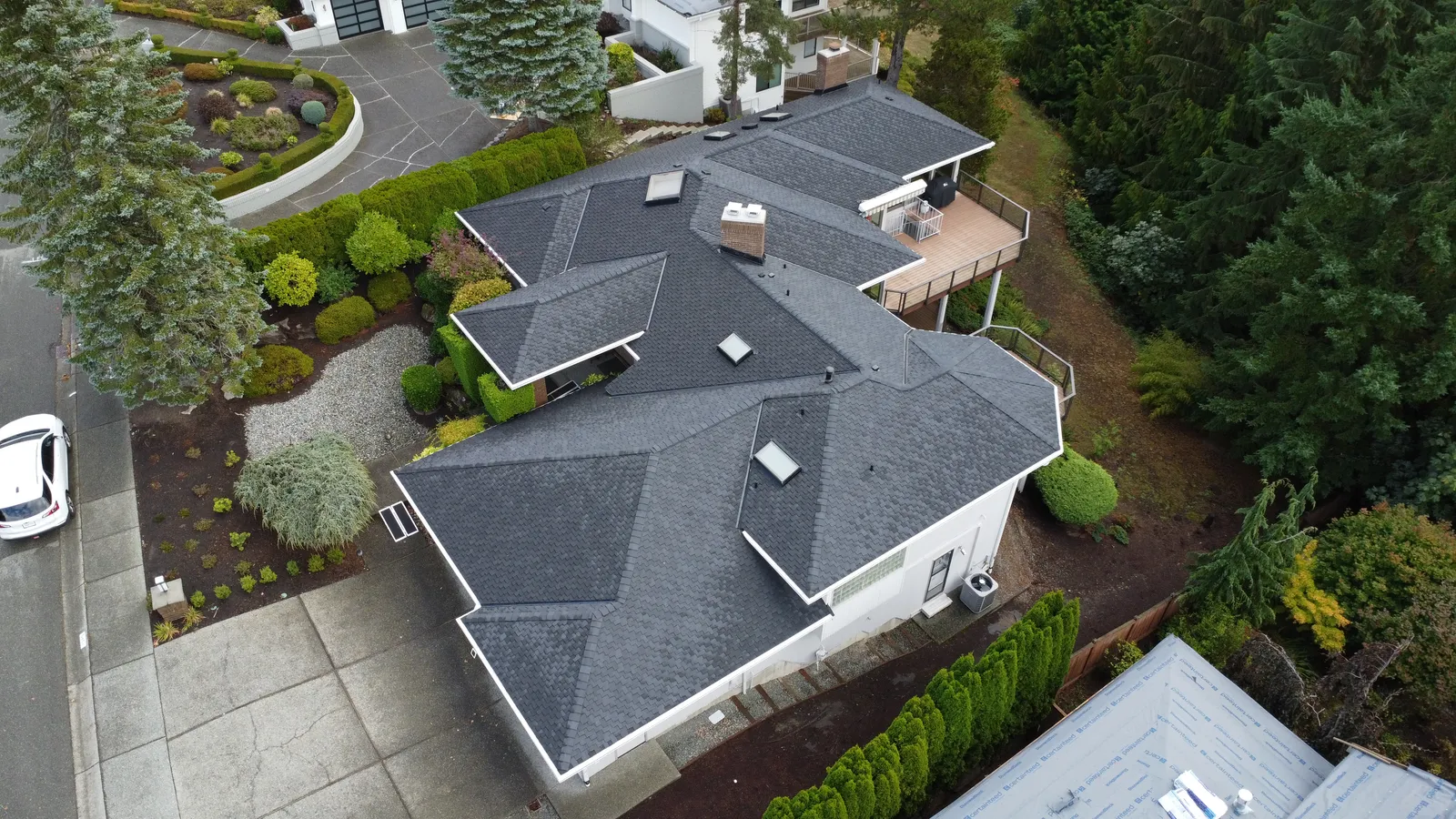 Aerial view of a completed roof replacement on a home in Bellevue, WA